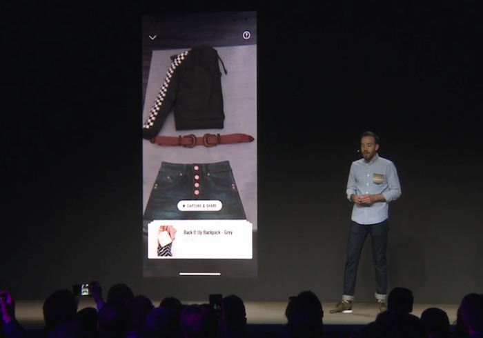 Daniel Beaucamp of Shopify on stage showing how AR works in ecommerce